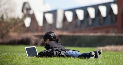 Student on laptop outside